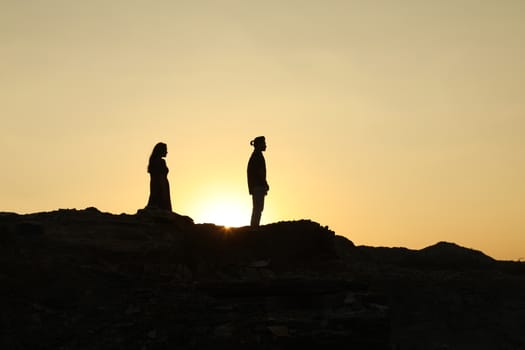 Silhouette of people on hill