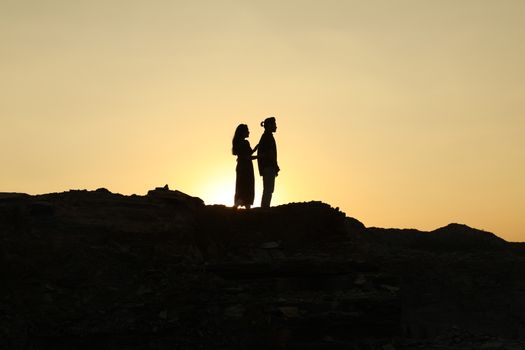 Silhouette of people on hill