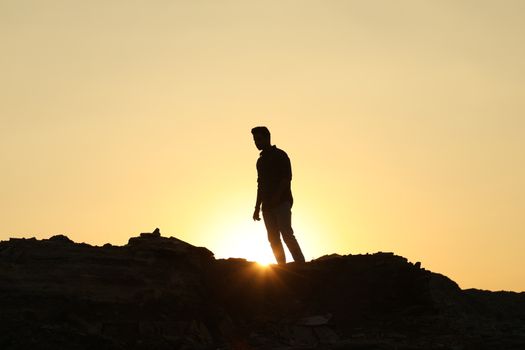 Silhouette of people on hill