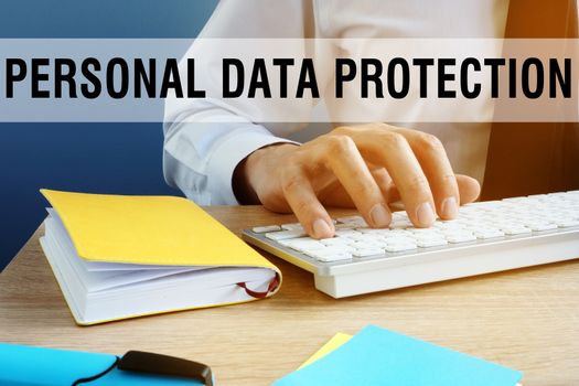 Personal data protection. Manager typing on a keyboard.