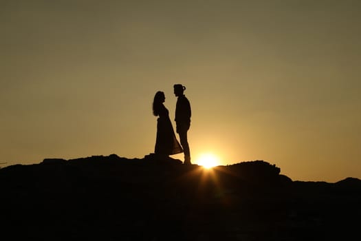 Silhouette of people on hill
