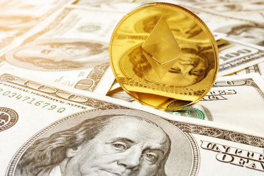 Ethereum ETH coin on a dollar bills. Cryptocurrency concept.
