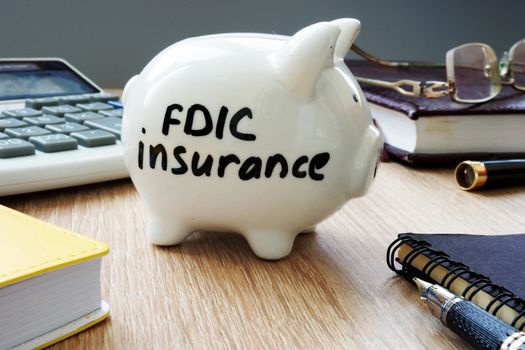 FDIC insurance policy on an office desk.