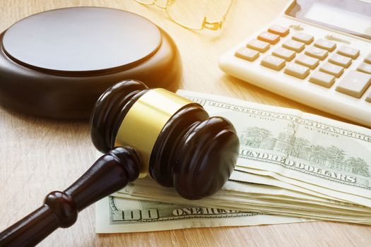 Financial fraud. White collar crime. Gavel, calculator and money.