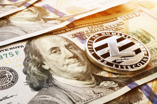Litecoin and dollar banknotes. Cryptocurrency exchange.