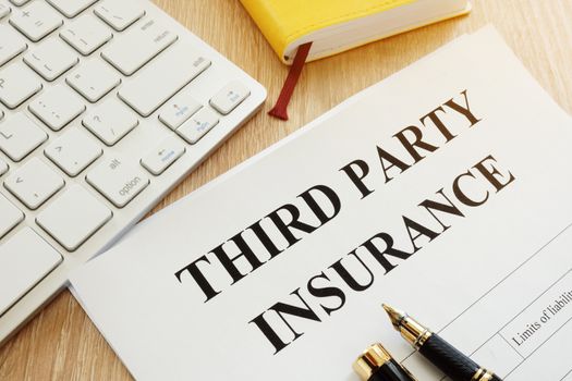 Third Party Insurance form on a desk.