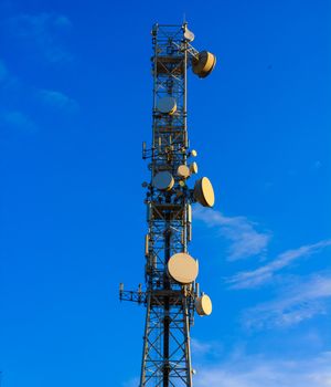 tower with  control devices and antennas, transmitters and repeaters for mobile communications and the Internet