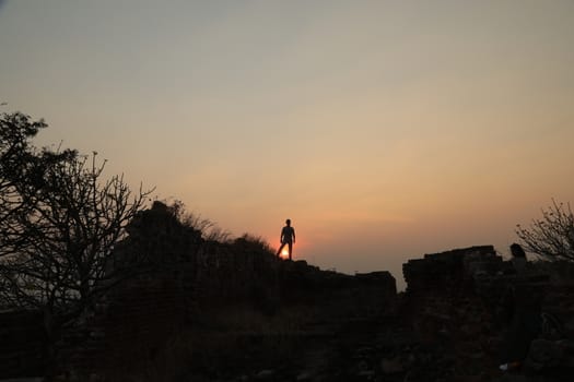Silhouette of people on hill
