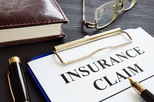 Insurance claim form and pen in the agency.