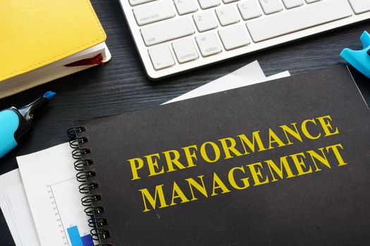 Performance management documents on an office table.