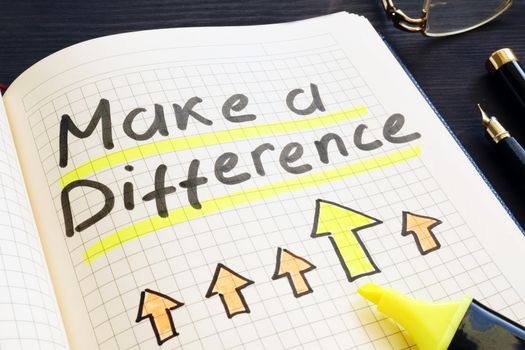 Make a difference handwritten in notepad.