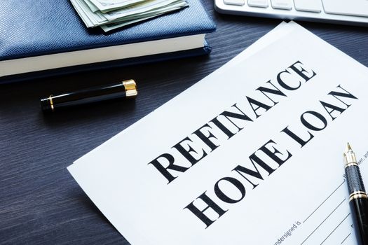 Refinance home loan form, pen and money.