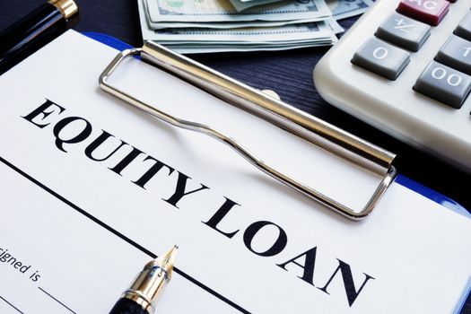 Equity loan application, pen and calculator.
