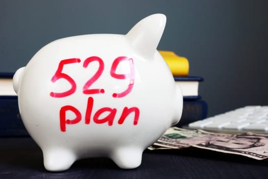 529 plan written on a piggy bank. College savings plan.