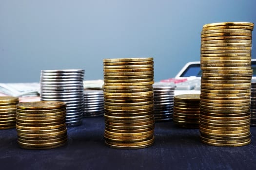 Business growth. Stack of coins and calculator. Financial wealth.