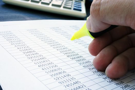 Audit. Auditor is checking financial report.