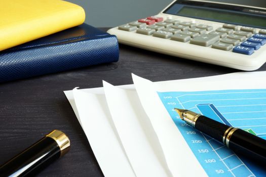 Audit. Business or financial report and calculator.