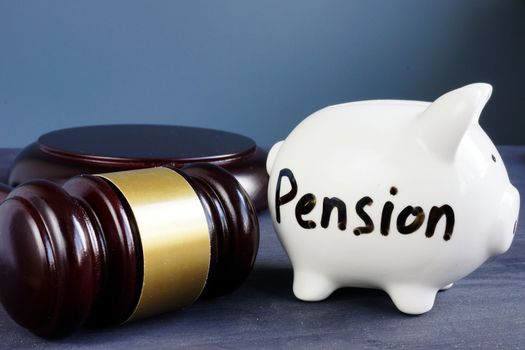 Legal issue with pension and retirement. Piggy bank in a court.