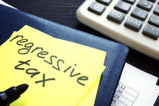 Regressive tax written on a memo stick.