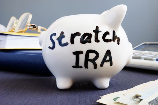 Stretch ira written on a piggy bank. Retirement.