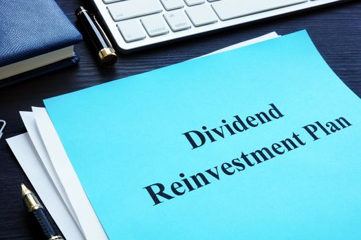 Dividend Reinvestment Plan - DRIP on the desk.
