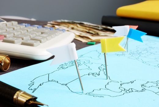 Global business. Map with flags and money.