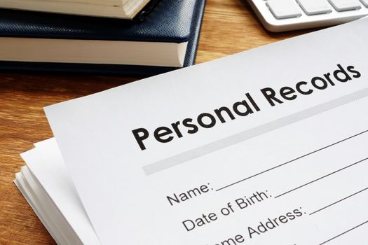 Personal records on a table. Privacy data.