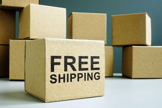 Free shipping sign on a cardboard box side.