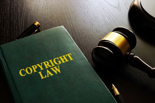 Copyright law and gavel on a table.