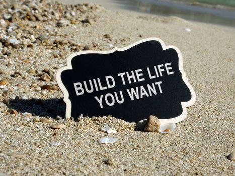 Build the life you want sign on the wooden plank.