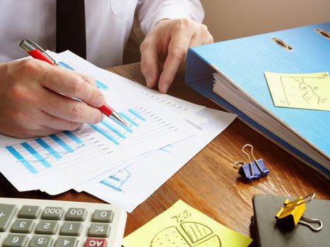 Bookkeeper working financial and budget report. Accounting concept.