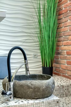 stone sink for pedicure on the floor