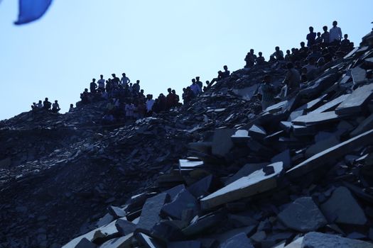 Silhouette of people on hill