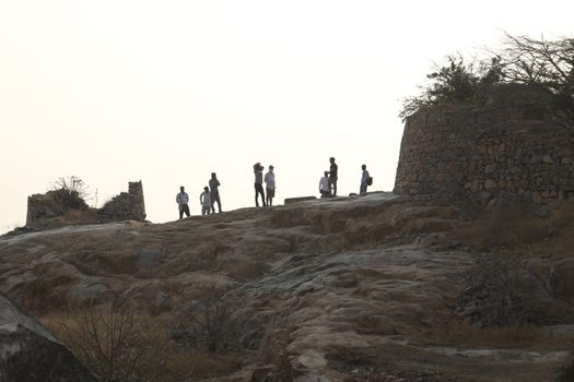 Silhouette of people on hill