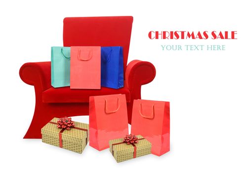 Composite image of a red armchair of Santa Claus with Christmas gifts and copy space (sample text).