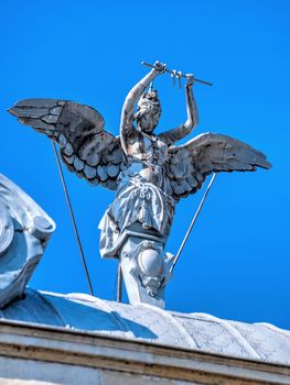 Ruse, Bulgaria - 07.26.2019. Sculpture on the roof of an old historical building in Ruse, Bulgaria, on a sunny summer day