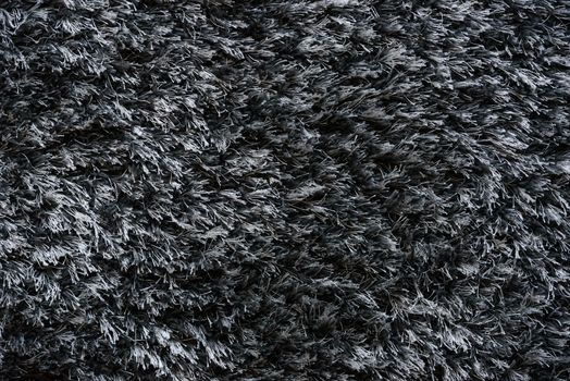 Grey carpet with long pile abstract texture background in close-up (high details)