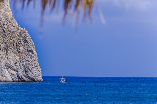 View of the blue color of the Mediterranean sea on the beach of Perissa Santorini Greece