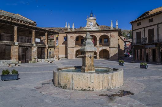 Source and government buildings of the town of ayllon spain