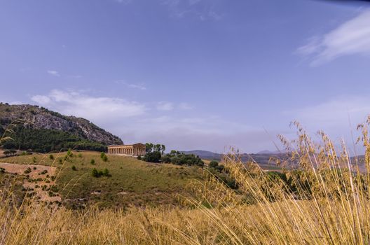 View of the greek temple of segesta and its surroundings in italy sicily