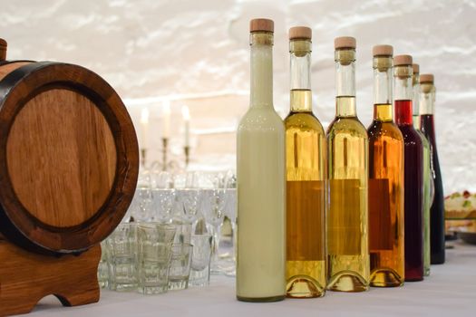 Collection of regional and traditional alcohol on the table during a social event in the restaurant.