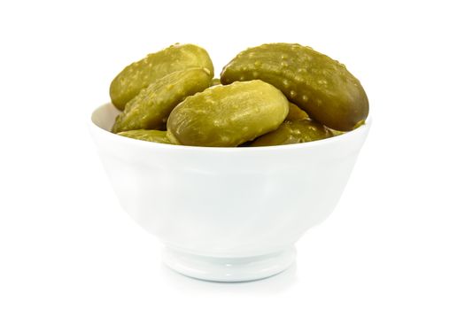 Bowl with pickled cucumbers on a white background in close-up