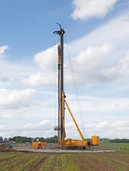 Foundation drill machine in the dutch flat landscape