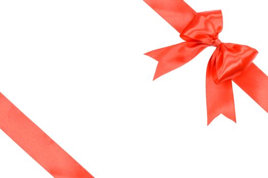 Gift card concept - shiny red satin ribbon with bow isolated on white background 