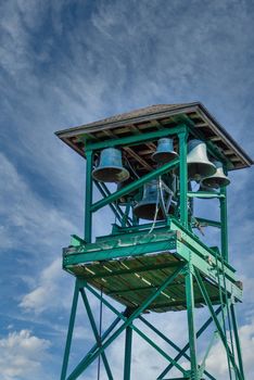 An old green tower in Bar Harbor with Church bells