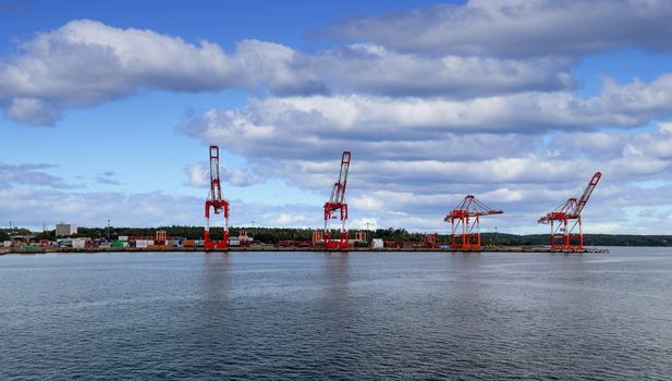 Heavy shipping cranes at a freight yard on the coast near Halifax, Nova Scotia, Canada