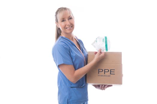 Nurse holding a delivered box of much needed N95 medical masks.  During the global pandemic of COVID-19, supplies of critical PPE for healthcare workers was in short supply