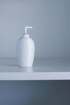 Blank label cosmetic container bottle as product mockup on gray background, hygiene and healthcare