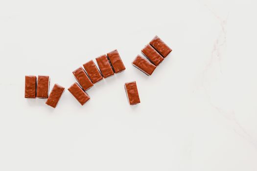 Milk chocolate candies isolated on white background, sweet food and tasty dessert