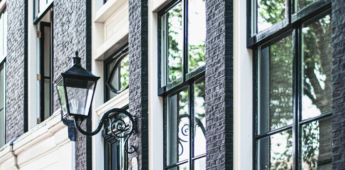 Architectural detail of a building on the main city center street of Amsterdam in Netherlands, european architecture